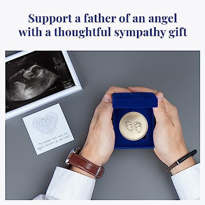 Miscarriage memorial gift for dad: memorial coin with baby feet held by male hands